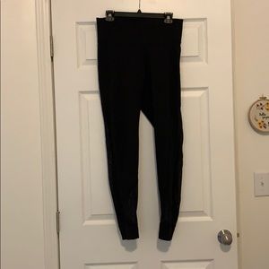 LuLu Lemon black leggings with asymmetrical mesh
